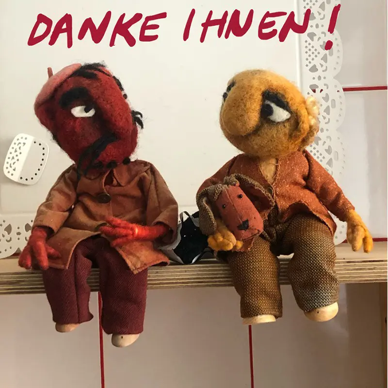 Zwei Puppen, die dir danken.
